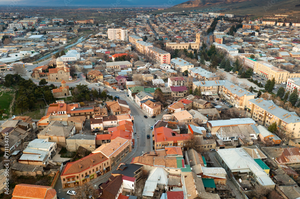 Obraz premium View from drone of houses at Gori town at spring day, eastern Georgia