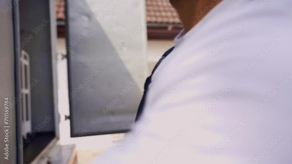 Caucasian young delivery man delivering package to customer at home. Caucasian young delivery man delivering package to customer at home.