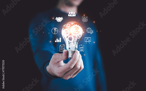Hand holding Light bulb, Technology solution, Digital link tech, Global Internet connection cloud computing. Digital marketing, Global business internet connection, Financial and banking, big data.