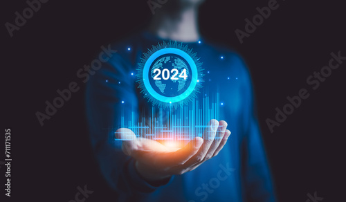 Businessman holding graph corporate growth 2024, New business startup and Goals target on 2024, Plans and Visions for Year 2024, Business Data, Opportunity, Planning, challenge and business strategy.