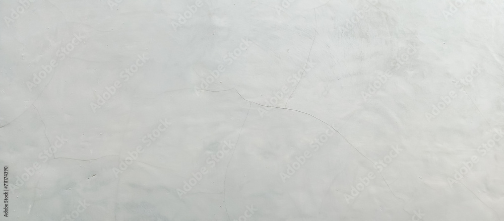 Fototapeta premium The texture of the old cement wall of gray paint, the background texture of the old cement wall of gray paint