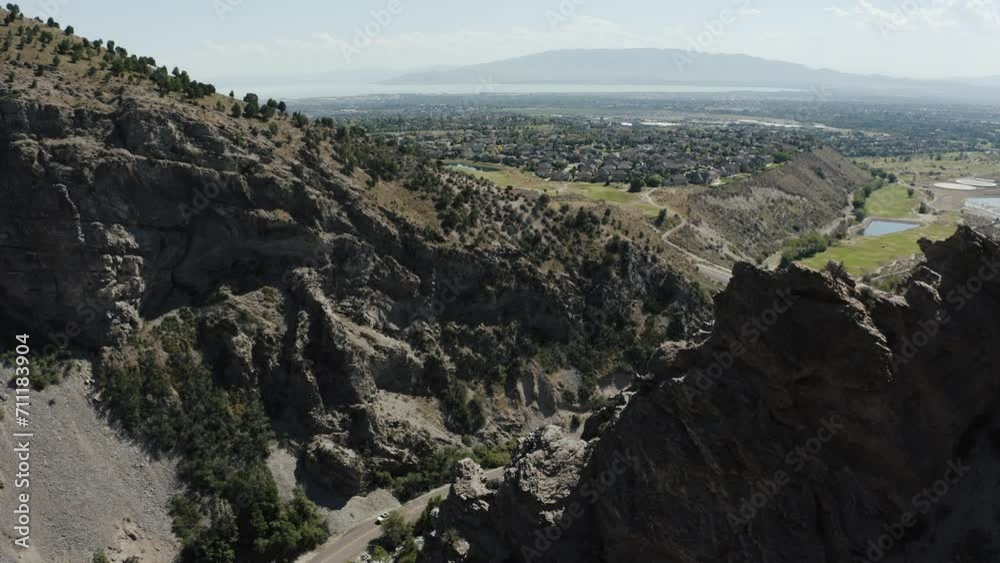 Drone shot revealing the valleys lying beneath Mount Timpanogos in Utah. Drone shot revealing the valleys lying beneath Mount Timpanogos in Utah.