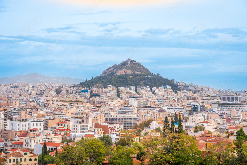 A hill top mountain rising above the city of Athens, Greece in Europe