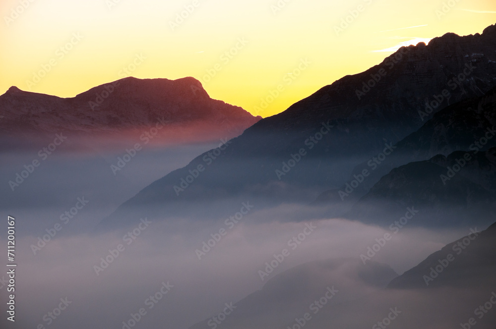 European Alps in Sunset Clouds Close UP Silhouette background - view from Mangart Saddle in Slovenia Europe