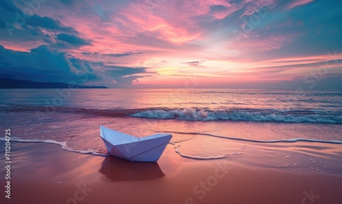 Tranquil Seascape with Colorful Sunset and Paper Boat on Sandy Beach © hisilly