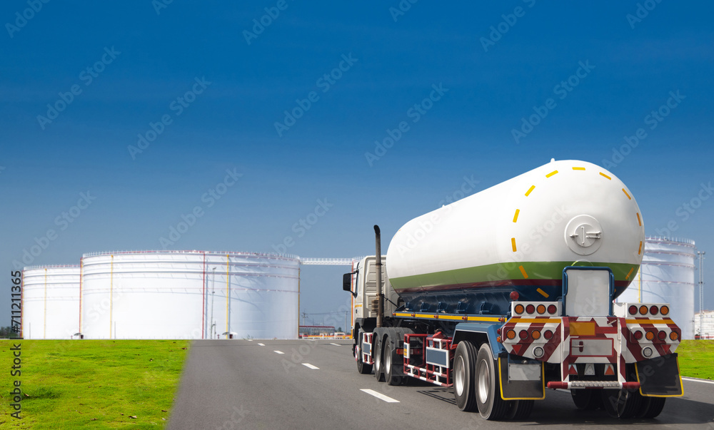 Naklejka premium Tanker Trucks and Large Oil Tanks are essential for the transportation and storage of oil and other petroleum products
