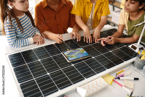 Teacher talking with kids about solar farms and renewable energy