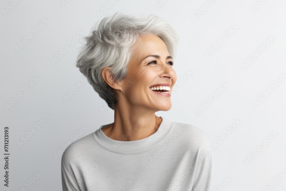 Portrait of happy senior woman with grey hair, isolated on white background Portrait of happy senior woman with grey hair, isolated on white background