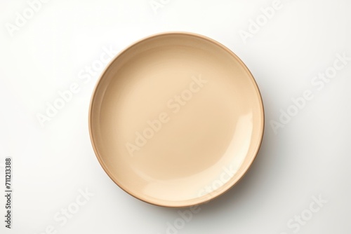 Empty beige plate on white background. photo