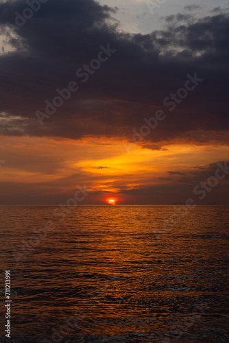 SunSet at Andaman Sea, Blue sky with Tropical beach white sand an exotic beach, view of waves break on tropical white sand beach.