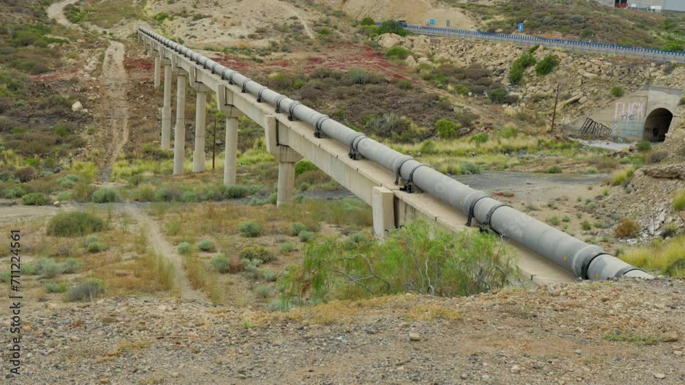 Aqueduct for old pipeline to cross valley in Tenerife island, tilt up view Aqueduct for old pipeline to cross valley in Tenerife island, tilt up view