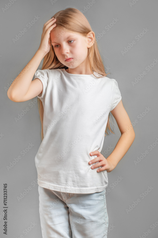 Little girl holding her head. Little girl holding her head.