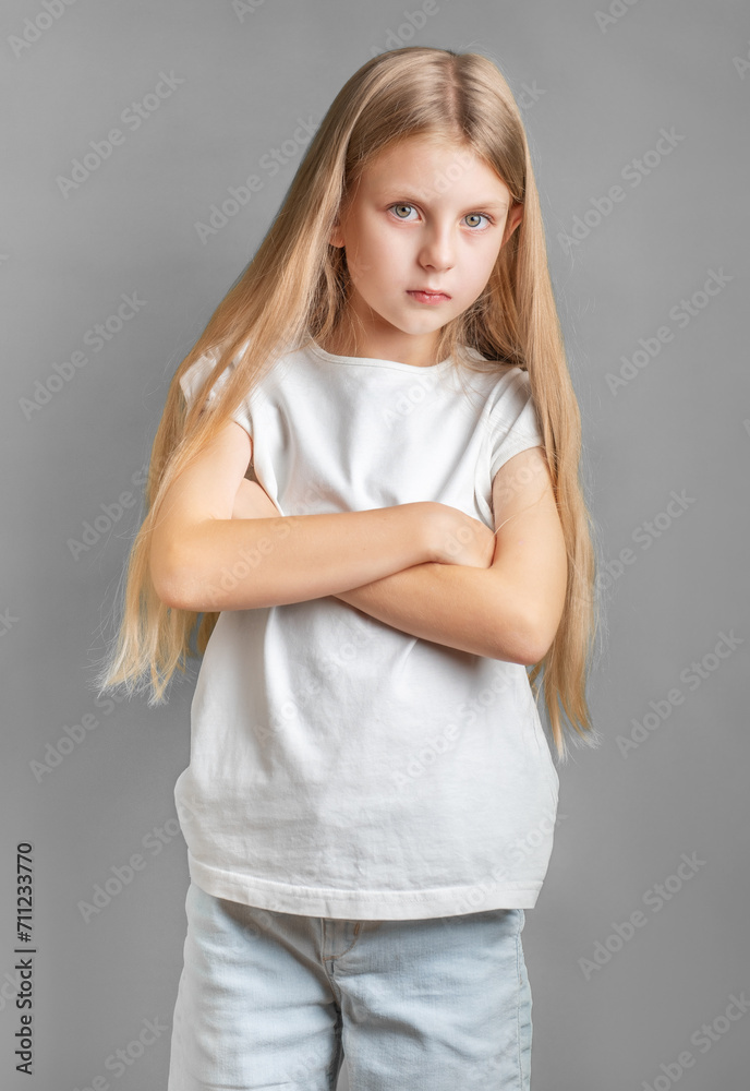 Portrait of sad little girl in white t-shirt Portrait of sad little girl in white t-shirt
