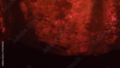 High speed slow motion of oil flowing in water bubbles slowly rises upwards photo