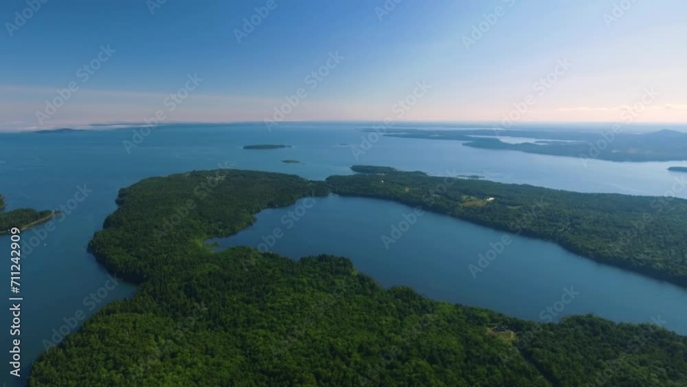 Beautiful landscape of many islands filled with lush green trees surrounded by clear blue water Beautiful landscape of many islands filled with lush green trees surrounded by clear blue water
