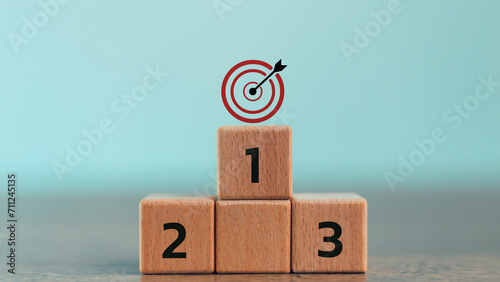 Numbers 1,2, 3 of wooden building blocks. Ranking, business strategy, leader market, competitive advantage, benchmarking concept. Winner, leader, target achievement, success.