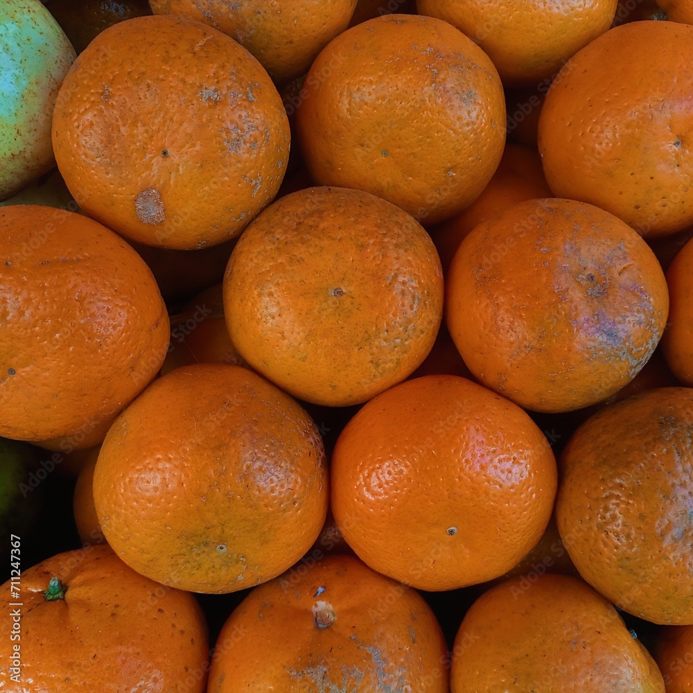 Oranges in a market. Rustic, textured orange backdrop. Oranges in a market. Rustic, textured orange backdrop.