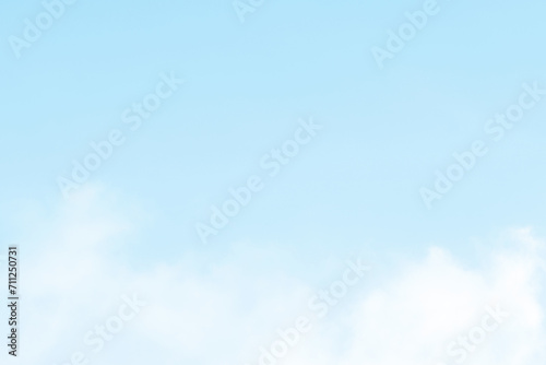 Pastel blue sky with white fluffy cloud. Soft smooth cumulus sky. Cloudscape background. Beautiful nature. Peaceful, Positive, Freedom and New life beginning background. 