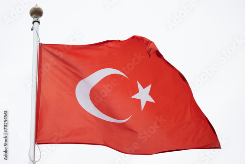 Flag of Turkey. A large Turkish flag flutters in the wind. Close-up. Great for news. Turkey flag on white background