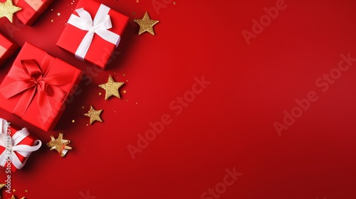 Festive Christmas gifts on red background with copy space for banner or advertisement