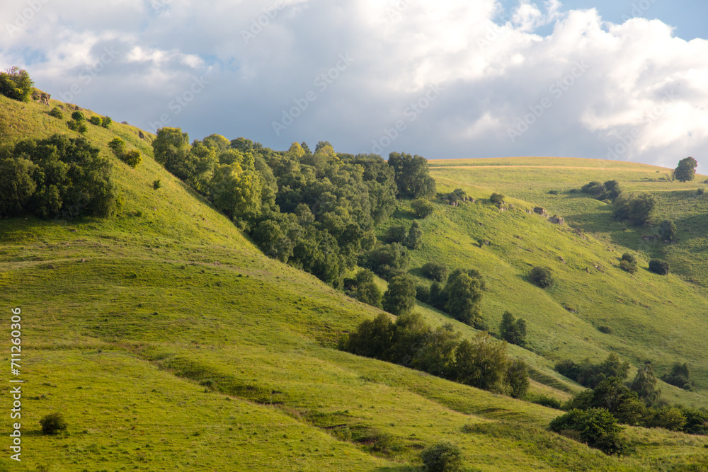 Green mountains in summer against the background of the sky with clouds Green mountains in summer against the background of the sky with clouds