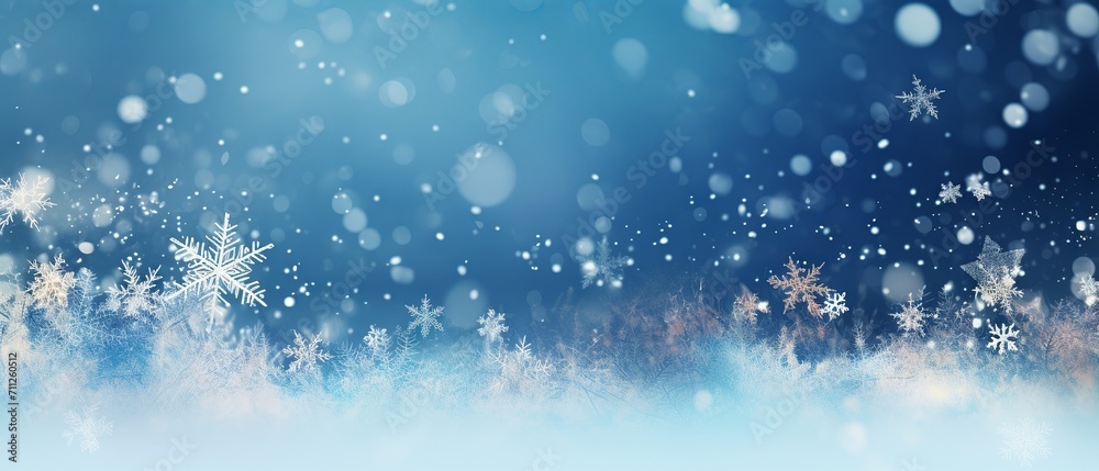 Winter wonderland: snowflakes and bokeh effect on a blue background