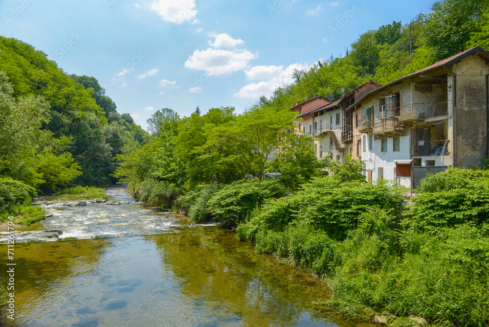 Old 18th century mill on the bank of the Olona river, now disused, known as Mulino del Celeste, near Gornate Superiore, a hamlet of Castiglione Olona, Italy. It had oil presses and a grain grind Old 18th century mill on the bank of the Olona river, now disused, known as Mulino del Celeste, near Gornate Superiore, a hamlet of Castiglione Olona, Italy. It had oil presses and a grain grind