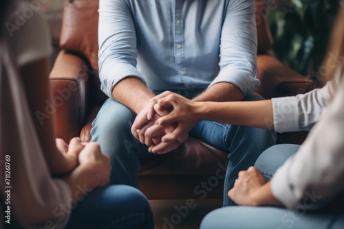 Group of People Sitting in a Circle Holding Hands in Unity, Couple hold hands to support each other while discussing family issues with a psychiatrist, AI Generated
