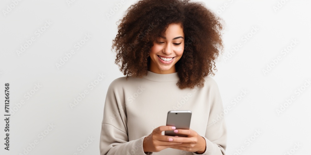Happy young woman playing music using a smartphone Happy young woman playing music using a smartphone