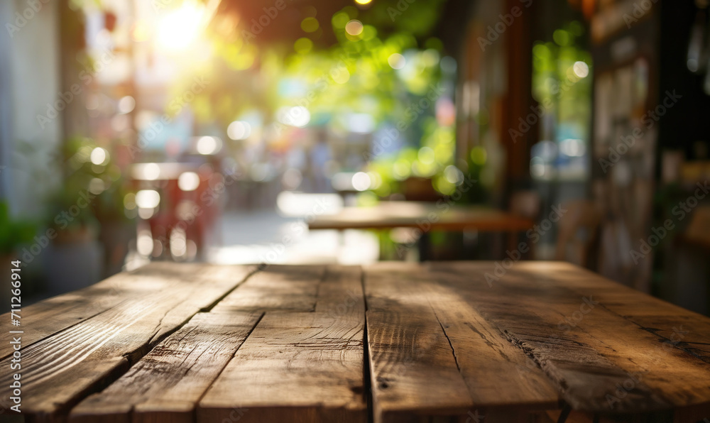 Empty wooden table with sunny cozy cafe interior on background Empty wooden table with sunny cozy cafe interior on background