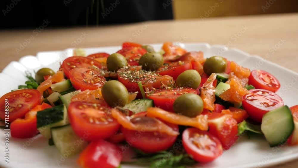 Spices are added to vegetable salad. Preparation of vegetable salad