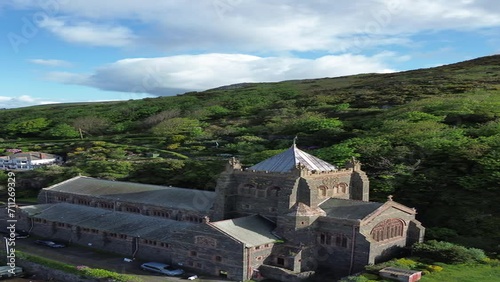 Ascending drone footage of the St John's Church and nearby buildings in Barmouth, Wales, UK photo