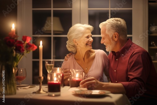 Old couple enjoying romantic dinner on Valentine Day at home. Senior couple shares dinner exchanging words of love sitting at table drinking wine