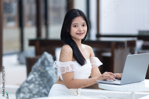 Portrait of asian freelance teenage people businesswoman casual working with laptop computer in cafe interior in coffee shop background,business expressed confidence embolden and successful concept Free Download Portrait of asian freelance teenage people businesswoman casual working with laptop computer in cafe interior in coffee shop background,business expressed confidence embolden and successful concept - GFXLoad