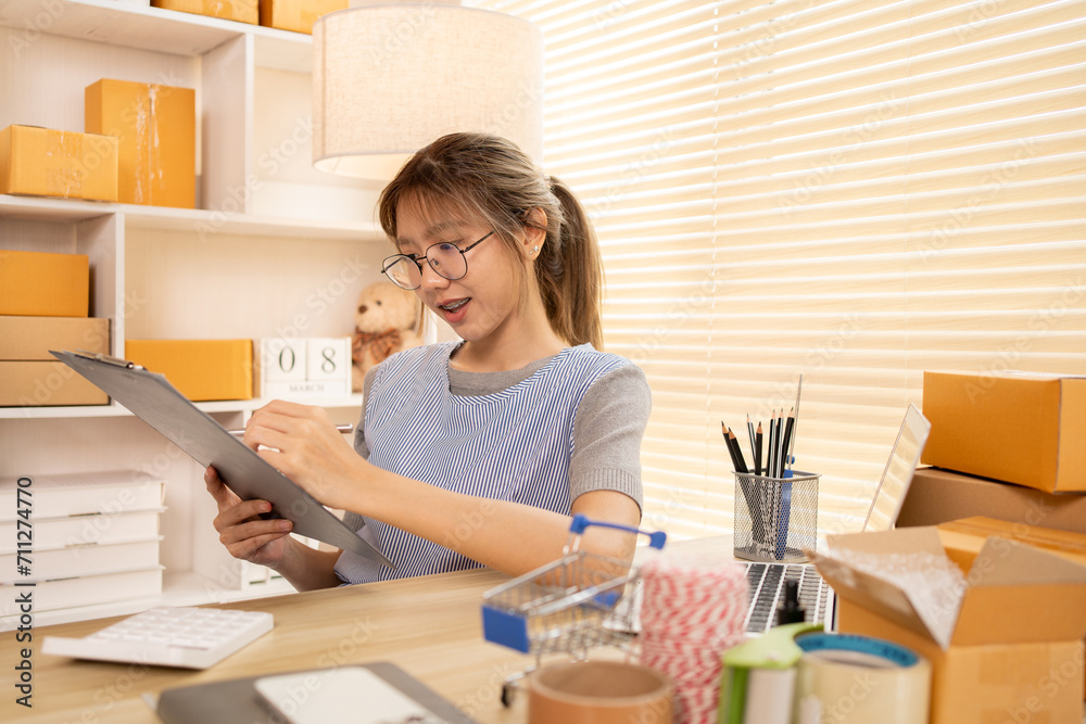 Check the product list, Online selling business, Small business owners are checking inventory in order to prepare them for proper delivery to customers, Working from Home. Check the product list, Online selling business, Small business owners are checking inventory in order to prepare them for proper delivery to customers, Working from Home.