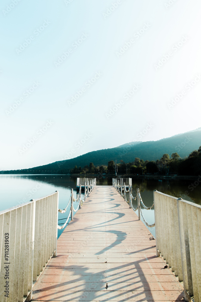 small pier at lake and mountains in clear sky weather. Huay Tueng Thao. thailand. flim tone.