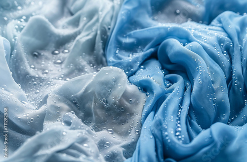 Wet clothes, laundry and soap water for laundromat business, housework and product background design. Blue, clothing and bubble wallpaper for clean clothes, eco friendly washing and backdrop photo