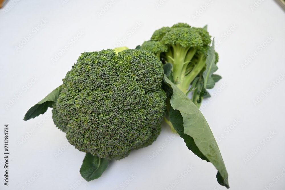 Broccoli Isolated on white background. Its other names Brassica oleracea var italica. This is an edible green plant in the cabbage family.  Broccoli is a particularly rich source of vitamin C and K.