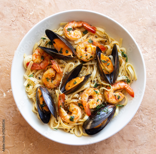 Tagliatelle pasta with shrimps and mussels. Seafood. Italian cuisine.