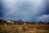 Seasonal landscape in country with rainbow
