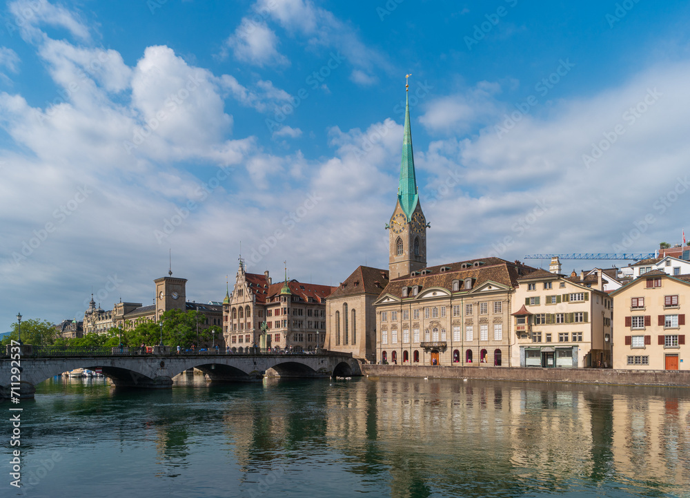 Zurich, Switzerland. Cityscape with Fraumunster church and Munsterbrucke bridge over the Limmat River.