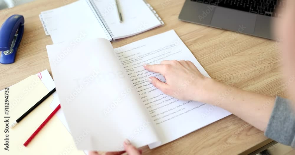 Actor leafing through script for play at table closeup 4k movie slow motion. How to get leading role in theater concept