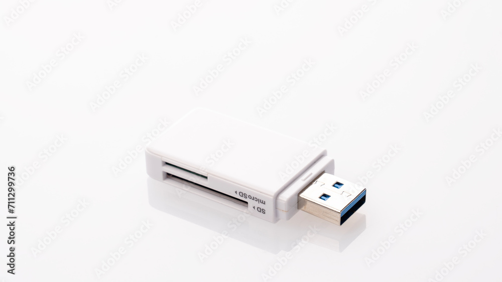 Flash card reader on white background Close-up, adapter SD to USB, microSD to USB Flash card reader on white background Close-up, adapter SD to USB, microSD to USB
