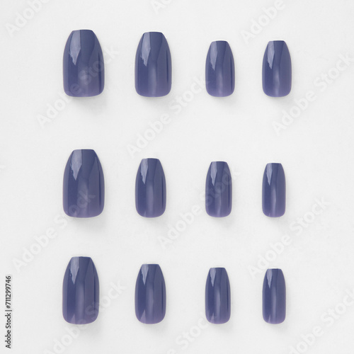 realistic set of colored false nails adhesive isolated on white background. top view. false nails acrylic nails for women. different fashion nail shapes.