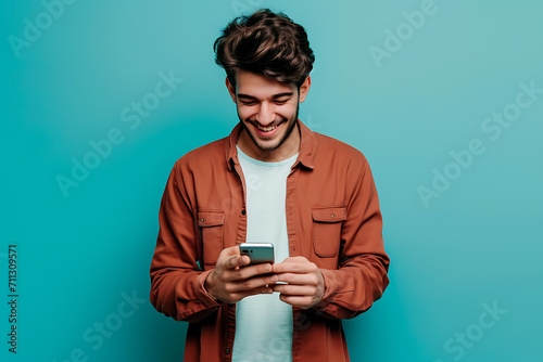 Mobile Joy, Smiling Latin Man Engages in E-commerce Shopping, blue background photo