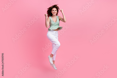 Photo of positive cute girl raised hands wear trendy clothes rejoice special seasonal offer good news isolated on pink color background