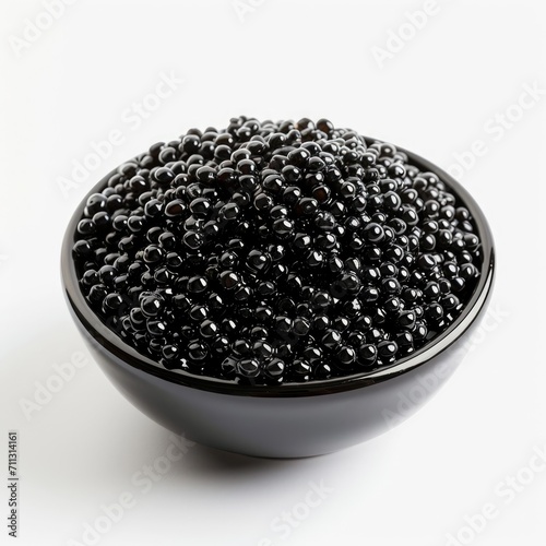 Heap of black caviar close-up on a white background.