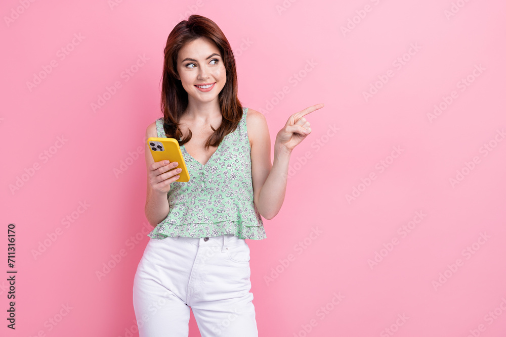 Photo of gorgeous cute girl wear stylish crop top hairdo demonstrate empty space special offer isolated on pink color background Photo of gorgeous cute girl wear stylish crop top hairdo demonstrate empty space special offer isolated on pink color background