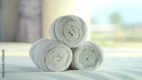 Beautifully folded white towels and toiletries. Luxury bedroom in the bedroom ,Bed, hotel, bedroom, hotel room, towel, liquid soap