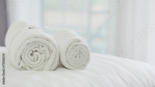 Fototapeta Naklejka Na Ścianę i Meble -  Beautifully folded white towels and toiletries. Luxury bedroom in the bedroom ,Bed, hotel, bedroom, hotel room, towel, liquid soap